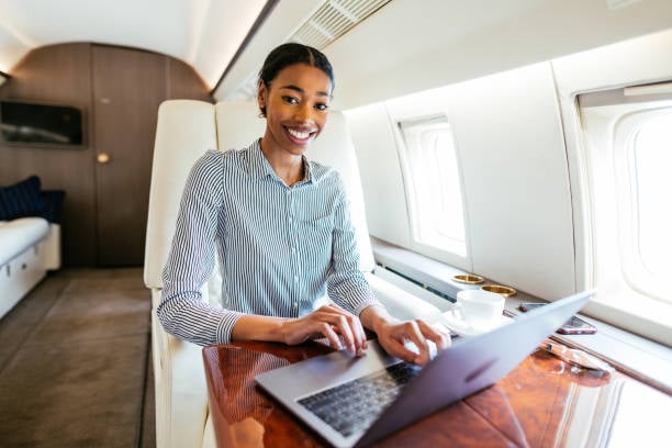 Wealthy passengers using private luxury jet to travel to destination